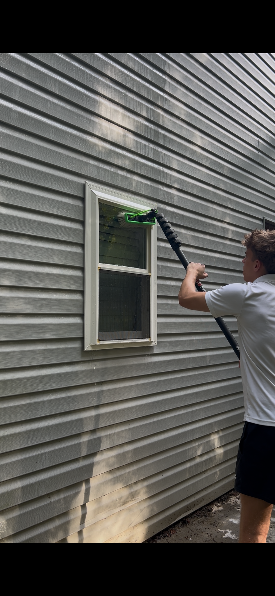 Cleaning a tall exterior window
